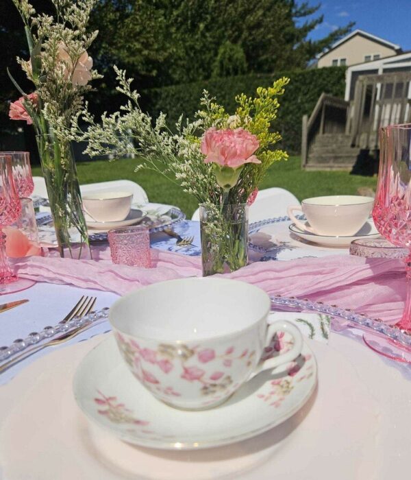 Photo of tea table set with Attainabilitea cups and saucer.